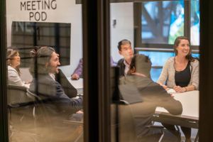 The Ally Co. brand photo containing meeting,room,group