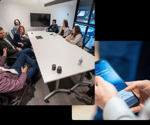 A group of culture assessment participants around a large boardroom table, looking at the facilitator who is telling a story with hand gestures. 